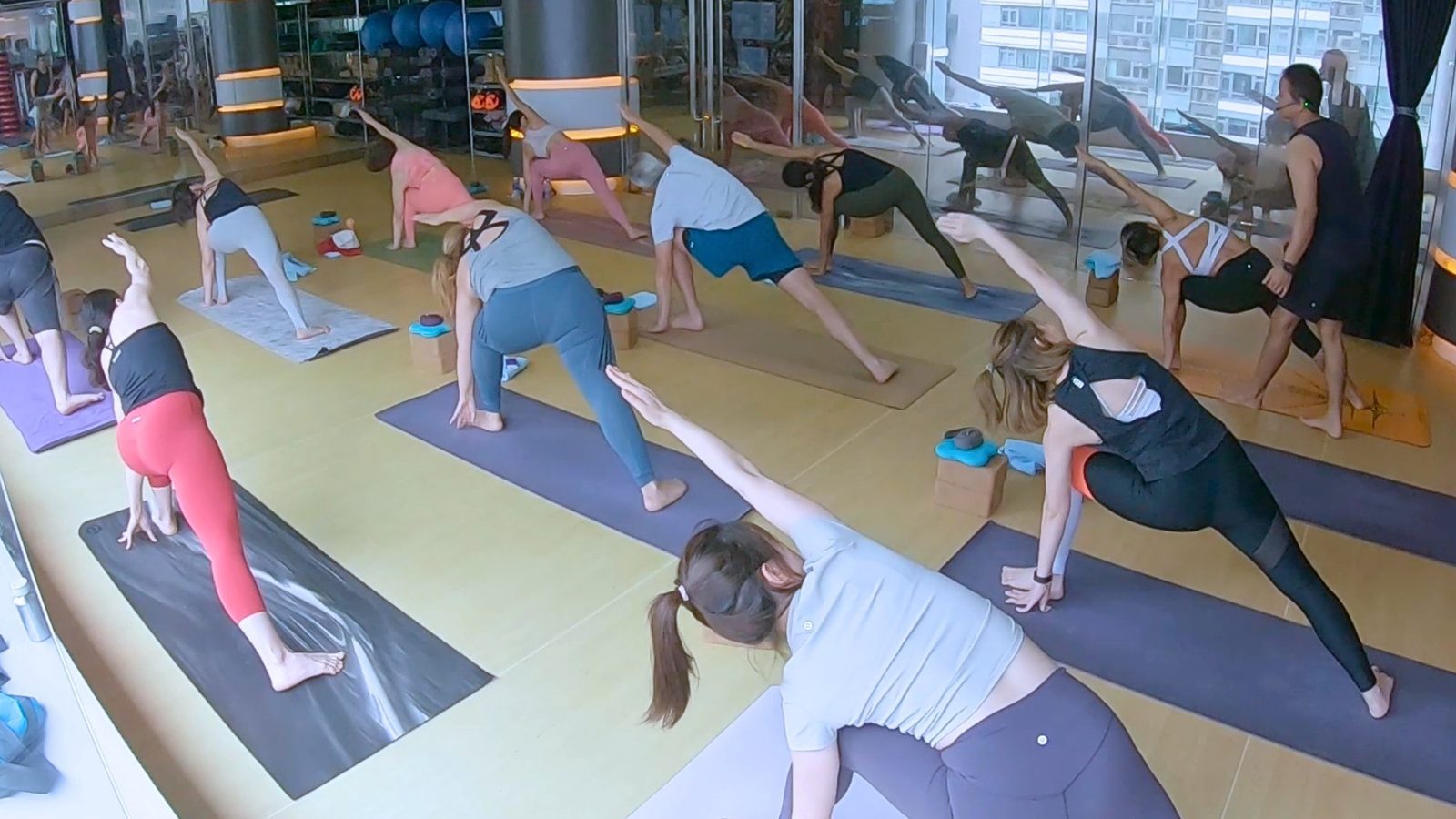 Led Ashtanga class in side angle pose